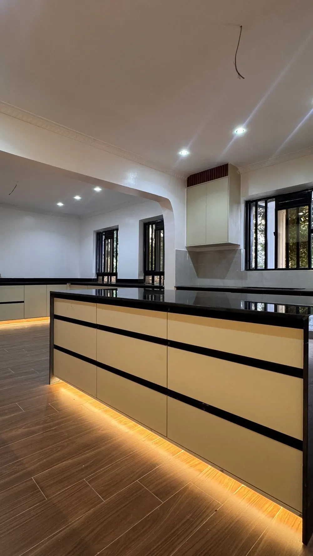 Handleless island drawers with plinth lighting